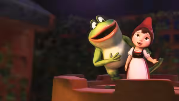 Juliet and a frog stand together atop a garden wall