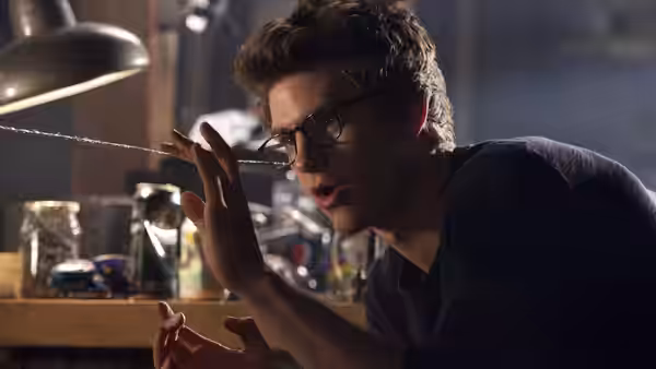 Peter Parker (Andrew Garfield) examines a strand of webbing in his bedroom