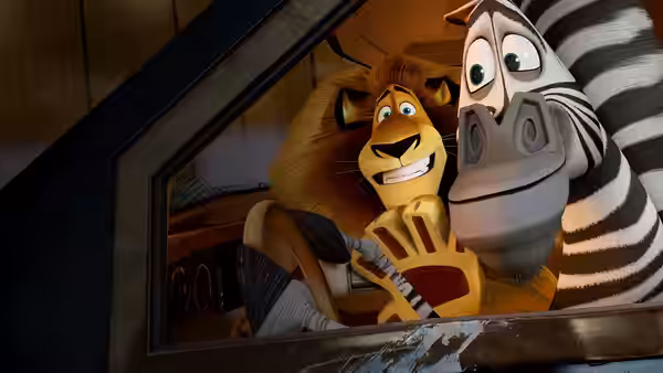 Alex and Marty peer through a vehicle window