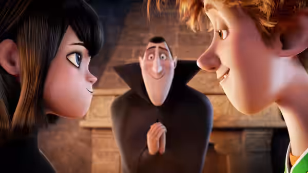 Mavis Dracula (Selena Gomez) and Jonathan (Andy Samberg) smile at each other as Dracula watches