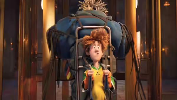 Jonathan (Andy Samberg) grips a luggage cart loaded with bags in the hotel lobby