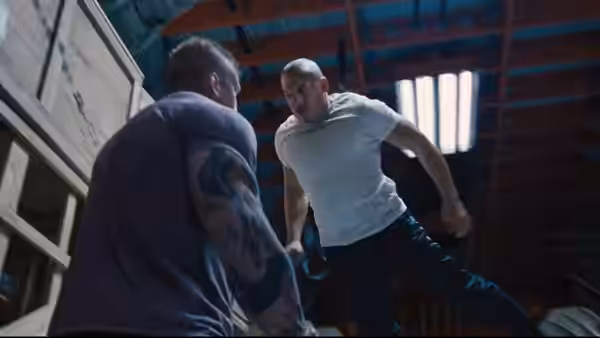Dominic Toretto (Vin Diesel) kicks at an opponent inside a warehouse