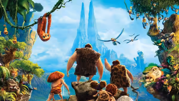 The Crood family gazes at towering blue formations in a lush, unfamiliar landscape