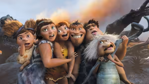 Grug (Nicolas Cage) gathers his family close as they pose together outdoors