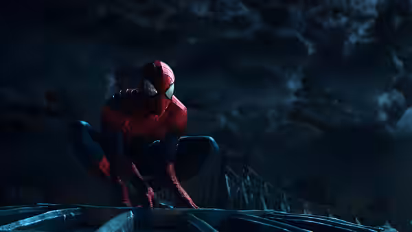 Spider-Man (Andrew Garfield) crouches on a rooftop beneath a cloudy night sky