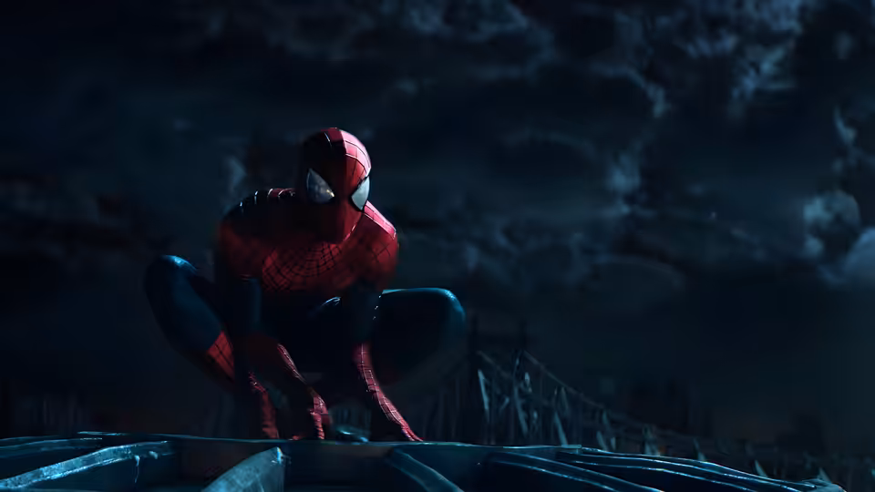 Spider-Man (Andrew Garfield) crouches on a rooftop beneath a cloudy night sky