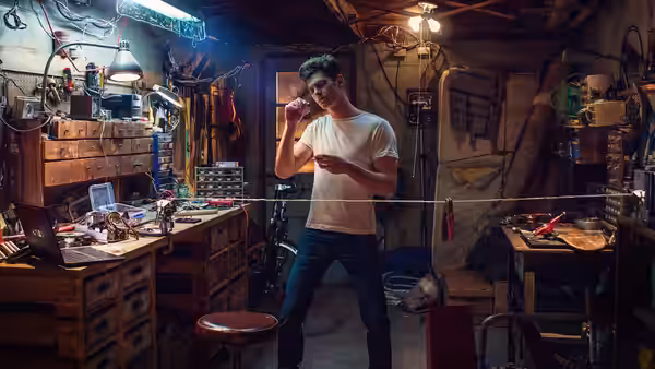 Peter Parker (Andrew Garfield) works with tools and webbing in his workshop