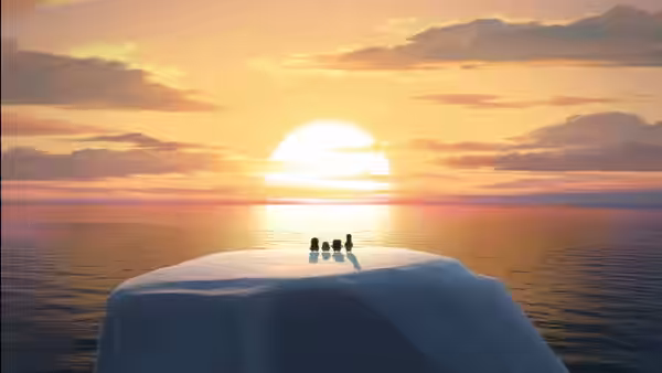 Four penguins stand together on an iceberg as the sun sets over the ocean
