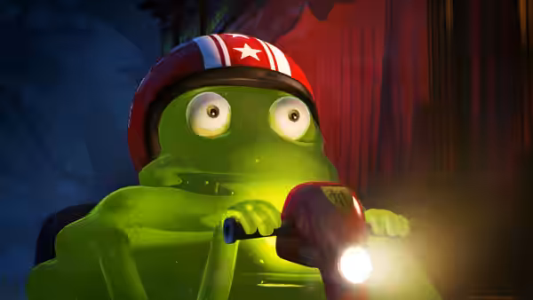 A glowing green blob monster wearing a helmet grips a bicycle handlebar