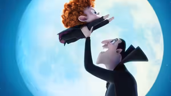 Dracula lifts curly-haired Dennis into the air before a full moon