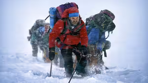 Beck Weathers (Josh Brolin) struggles uphill through deep snow with fellow climbers