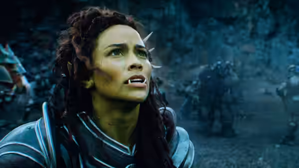 Garona (Paula Patton) looks upward amid a wooded battlefield