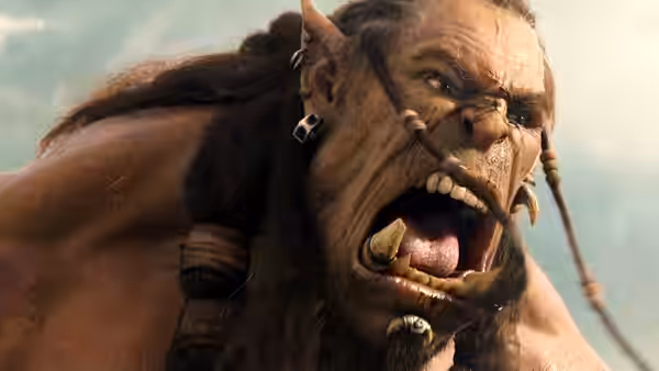 An enraged orc roars against a bright sky