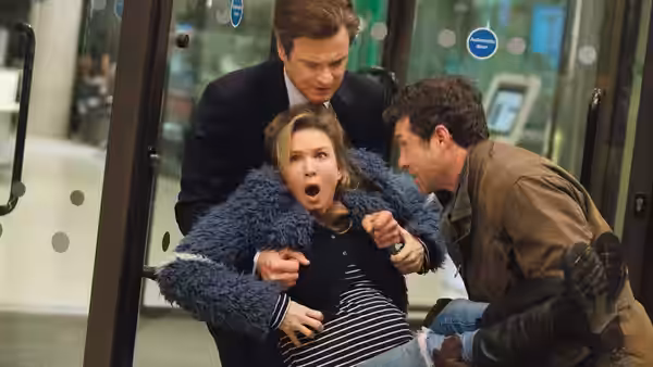 Bridget Jones (Renée Zellweger) clutches her belly between Mark Darcy (Colin Firth) and Jack Qwant (Patrick Dempsey)