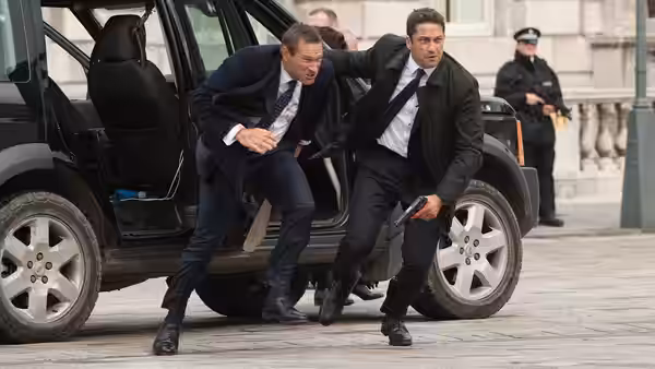 Mike Banning (Gerard Butler) helps President Benjamin Asher (Aaron Eckhart) flee a vehicle