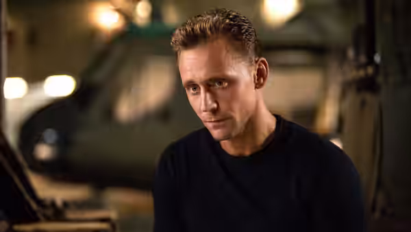 Captain James Conrad (Tom Hiddleston) sits in a dimly lit military hangar
