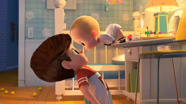 Tim leans backward as Boss Baby crawls across the kitchen counter