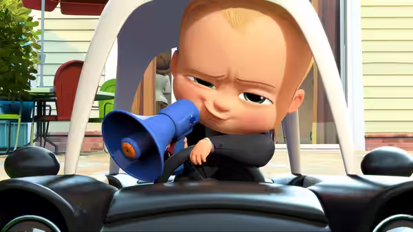 Boss Baby aims a blue megaphone from a toy car