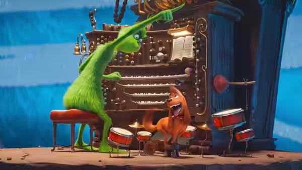 The Grinch plays an organ while Max drums beside him