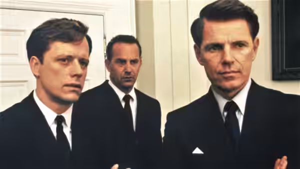 John F. Kennedy (Bruce Greenwood) and Robert F. Kennedy (Steven Culp) stand with an aide