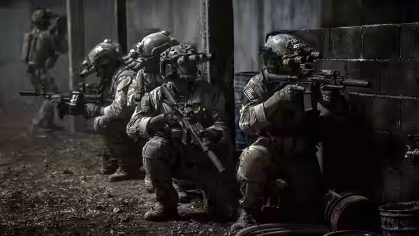 Armed soldiers in tactical gear positioned inside a concrete bunker