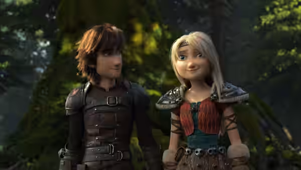 Hiccup (Jay Baruchel) and Astrid (America Ferrera) walk together through a forest