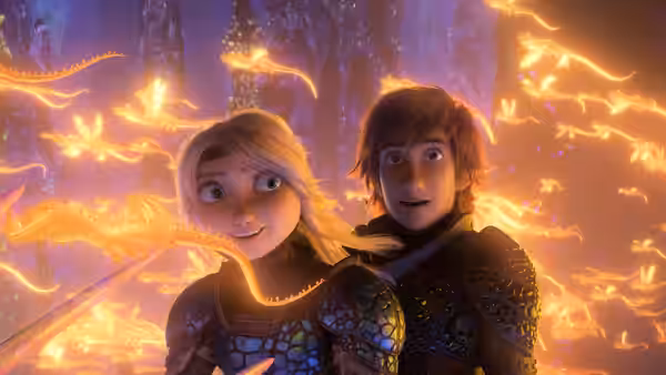 Astrid (America Ferrera) and Hiccup (Jay Baruchel) watch glowing dragons in a cavern