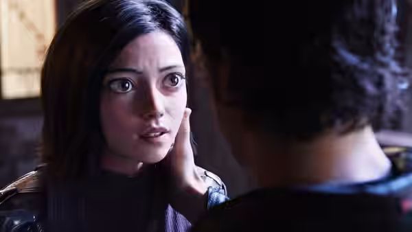Alita (Rosa Salazar) looks at Hugo as he gently touches her cheek