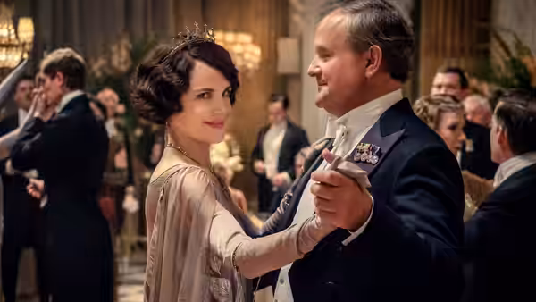 Cora Crawley (Elizabeth McGovern) and Robert Crawley (Hugh Bonneville) dance at a formal ball