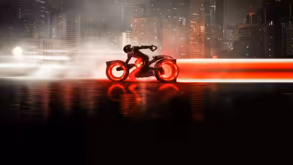 A suited figure rides a glowing motorcycle across a rain-slicked neon city street