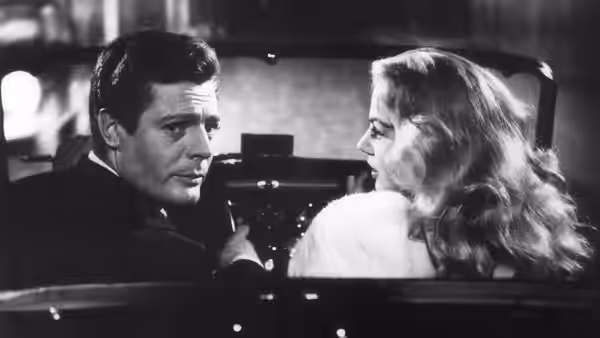 Marcello Rubini (Marcello Mastroianni) and Sylvia (Anita Ekberg) face each other inside a car
