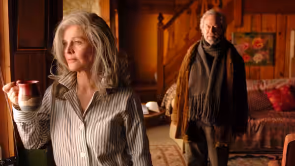 Fiona (Julie Christie) holds a mug while Grant (Gordon Pinsent) stands behind her at home