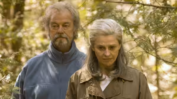 Fiona (Julie Christie) and Grant (Gordon Pinsent) walk together beneath trees