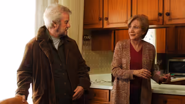 Grant (Gordon Pinsent) talks with Marian (Olympia Dukakis) in a kitchen
