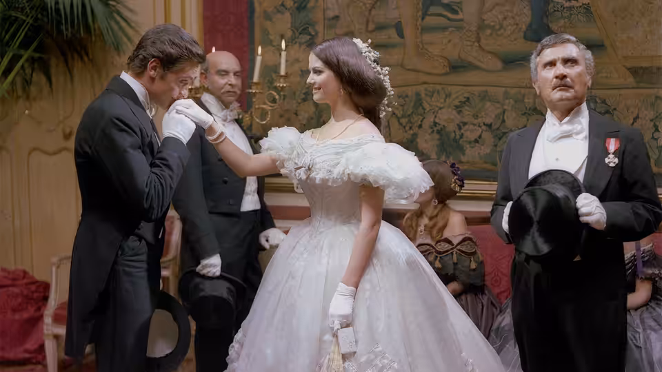 Angelica (Claudia Cardinale) dances in a white gown as Prince Fabrizio (Burt Lancaster) watches