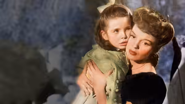 Anna Smith (Mary Astor) holds Tootie Smith (Margaret O'Brien) close