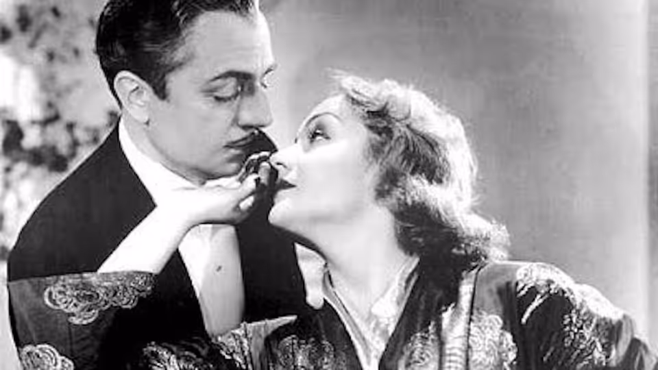 Godfrey (William Powell) and Irene Bullock (Carole Lombard) lean together for a kiss