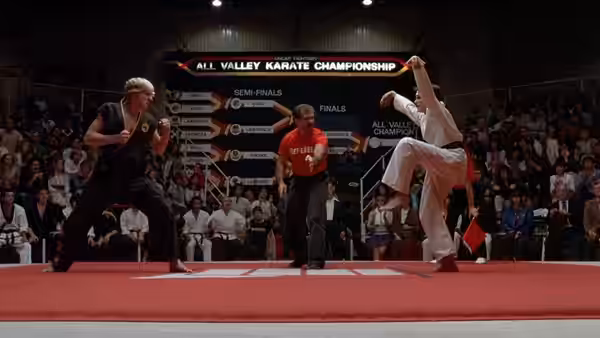 Two competitors facing off on the mat at the All Valley Karate Championship