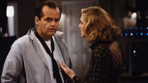 Charley Partanna (Jack Nicholson) faces Irene Walker (Kathleen Turner) during an intense conversation indoors