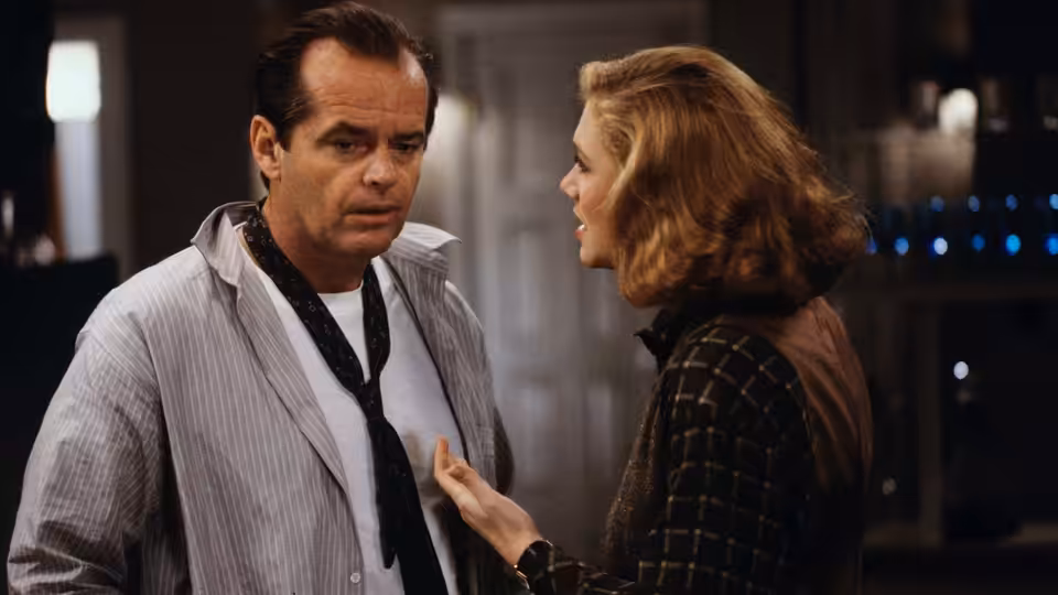 Charley Partanna (Jack Nicholson) faces Irene Walker (Kathleen Turner) during an intense conversation indoors