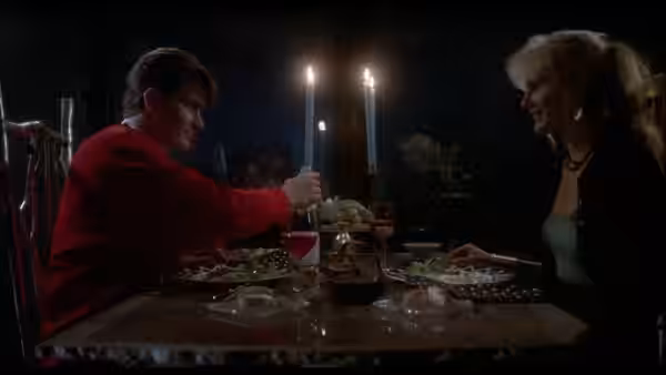 Bud Fox (Charlie Sheen) dines with Darien Taylor (Daryl Hannah) at a candlelit table