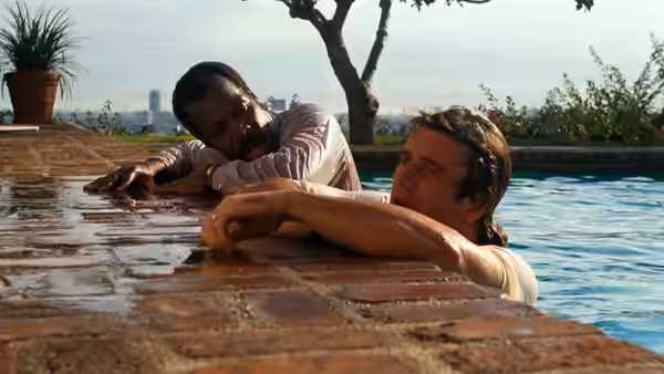 Roger Murtaugh (Danny Glover) and Martin Riggs (Mel Gibson) at a pool edge