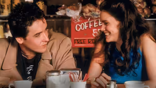 Lloyd Dobler (John Cusack) and Diane Court (Ione Skye) at a diner counter