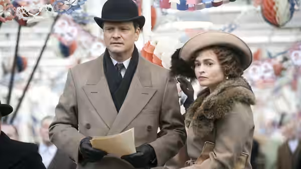 King George VI (Colin Firth) and Queen Elizabeth (Helena Bonham Carter) at an outdoor event