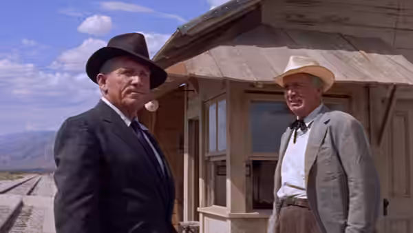 John J. Macreedy stands with Tim Horn outside the railroad station
