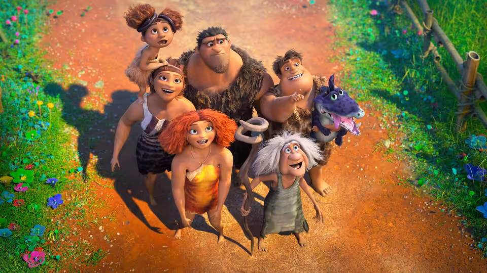 The Crood family gathers on a forest path and looks upward