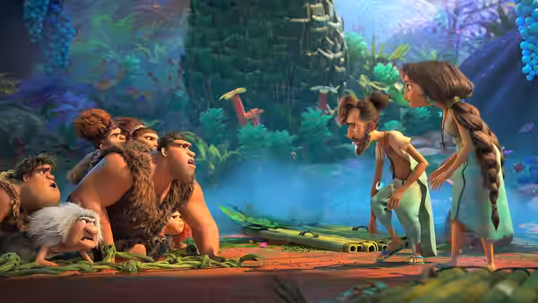 The Crood family meets two women beside a pool in the jungle