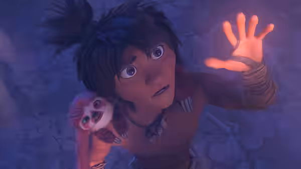 Dawn reaches upward while a small sloth clings to her shoulder