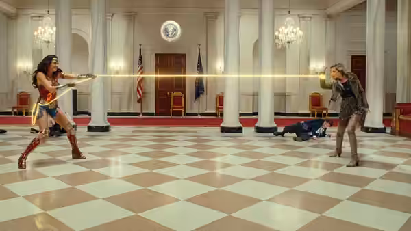 Diana Prince (Gal Gadot) fires her lasso across a marble hall at Barbara Minerva (Kristen Wiig)