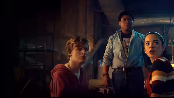 Simon (Fred Hechinger), Josh (Benjamin Flores Jr.) and Kate (Julia Rehwald) react inside a dim room